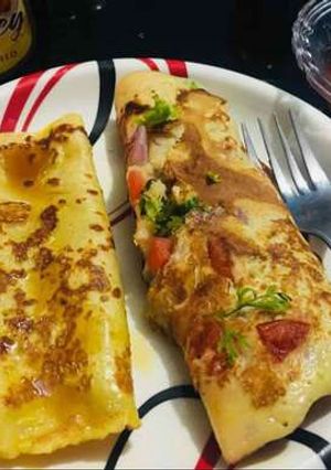 A picture of Dim Gola Rooti - plain and masala(Bengali pancake).
