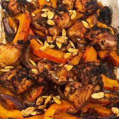 Tray bake pumpkin & chicken thighs topped with roast pumpkin seeds A picture of Tray bake pumpkin & chicken thighs topped with roast pumpkin seeds.