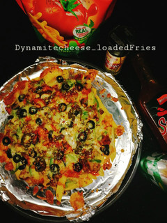 A picture of Dynamite cheese loaded fries.