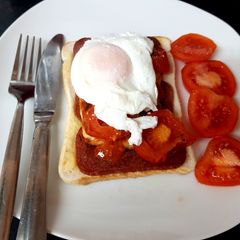 A picture of My Bacon Grill, Halloumi, Tomato & Poached Egg.