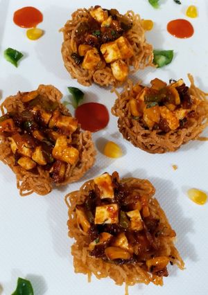 A picture of Spicy Schezwan Noodle Nest.
