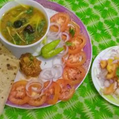 A picture of FRY MAASH KI DAAL WITH ROTI ACHAR & KACHOOMAR SALAD.