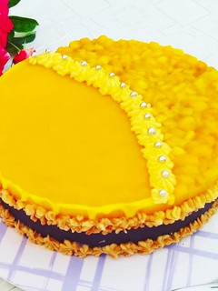 Käsekuchen mit Mangodecke Rezepthauptbild