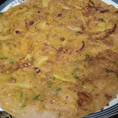 A picture of Baisan Wali missi Roti with fries.