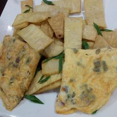 A picture of Fried yam and egg.