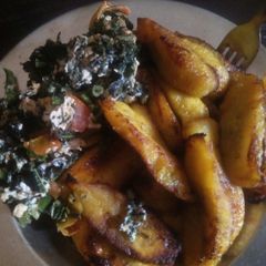 A picture of Fried plaintain with eggs and veggies.