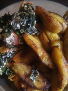 A picture of Fried plaintain with eggs and veggies.