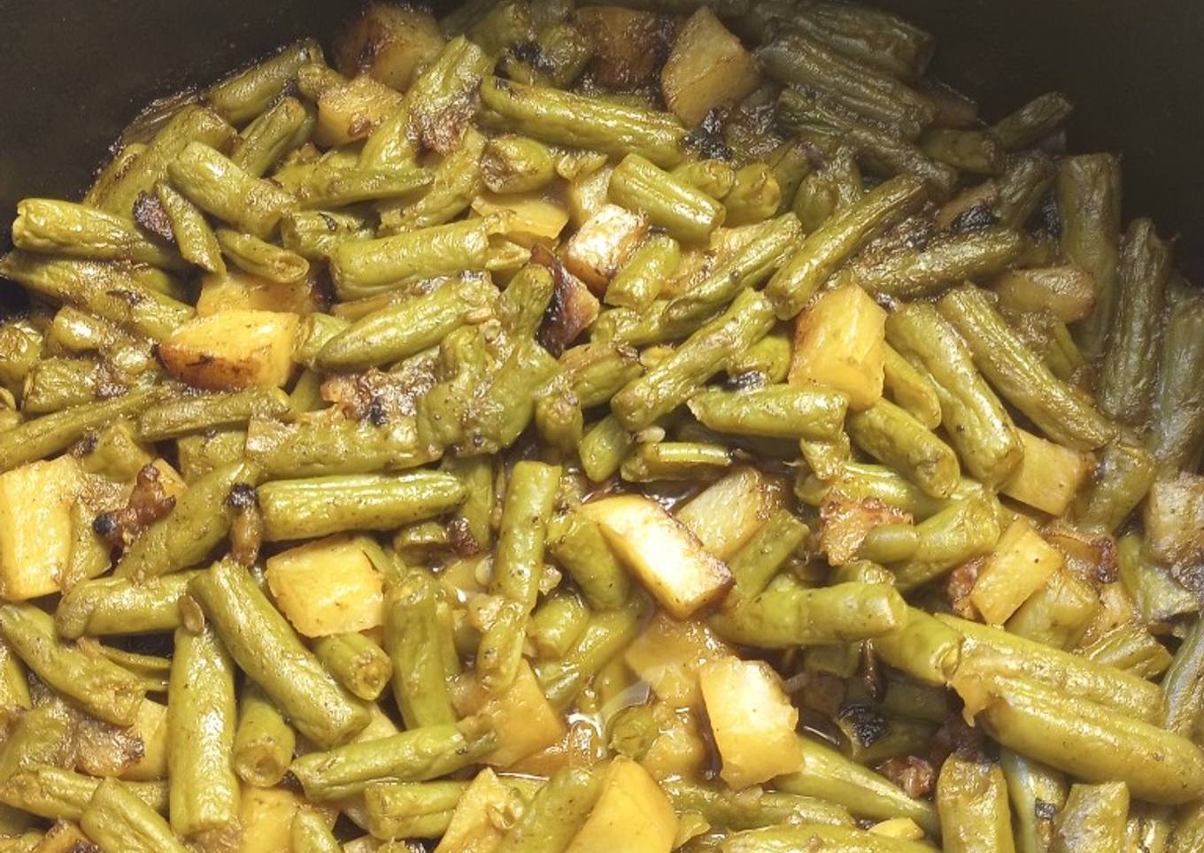 Baked onion with green beans and potatoes