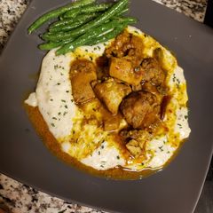 Curried chicken & grits 🌶🌶🌶 A picture of Curried chicken & grits 🌶🌶🌶.