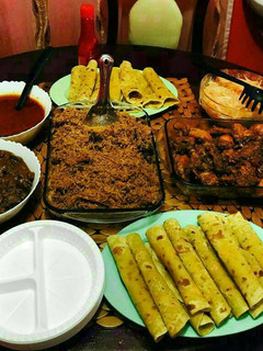 A picture of Chapati, Pilau, Deep Fried Chicken, Fried Liver, Tomato Soup.