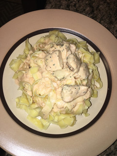 A picture of Egg pasta with creamy rose sauce.