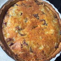 A picture of Ham, Mushroom, and Red Onion Quiche.