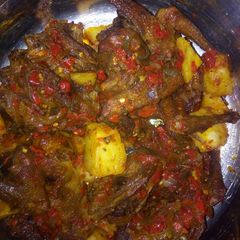 A picture of Peppered chicken with potato.