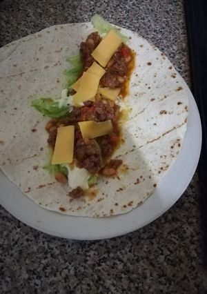 A picture of Wrap with mince, lettuce and cheese.