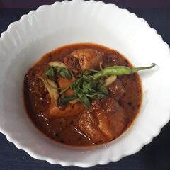 A picture of Chicken Koyla Karahi (Smoked Chicken Karahi).