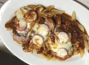 Una foto de Pollo con queso y jamón