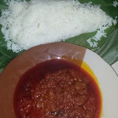 A picture of Ofada rice and stew.