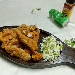 A picture of KFC style chicken tenders.