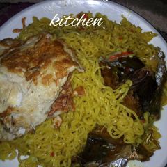 A picture of Indomie and Egg with Titus.