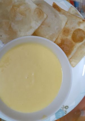 A picture of Mango shake with pori.
