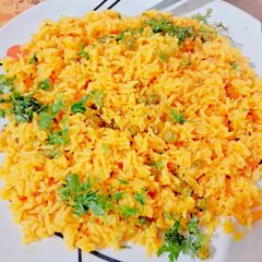 A picture of Frozen peas tomato pulav.