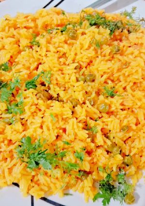 A picture of Frozen peas tomato pulav.