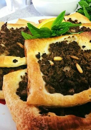A picture of Lahm bi Ajeen (Middle Eastern Meat Pies).