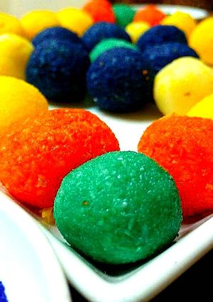 A picture of Holi special colorful coconut ladoo.