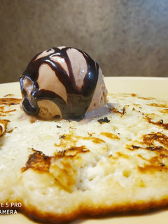 A picture of Banana Pan Cake with Chocolate Ice cream.