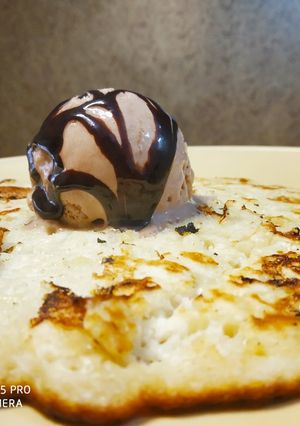 A picture of Banana Pan Cake with Chocolate Ice cream.