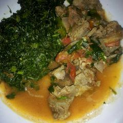 A picture of Beef stew and Fried Kale.