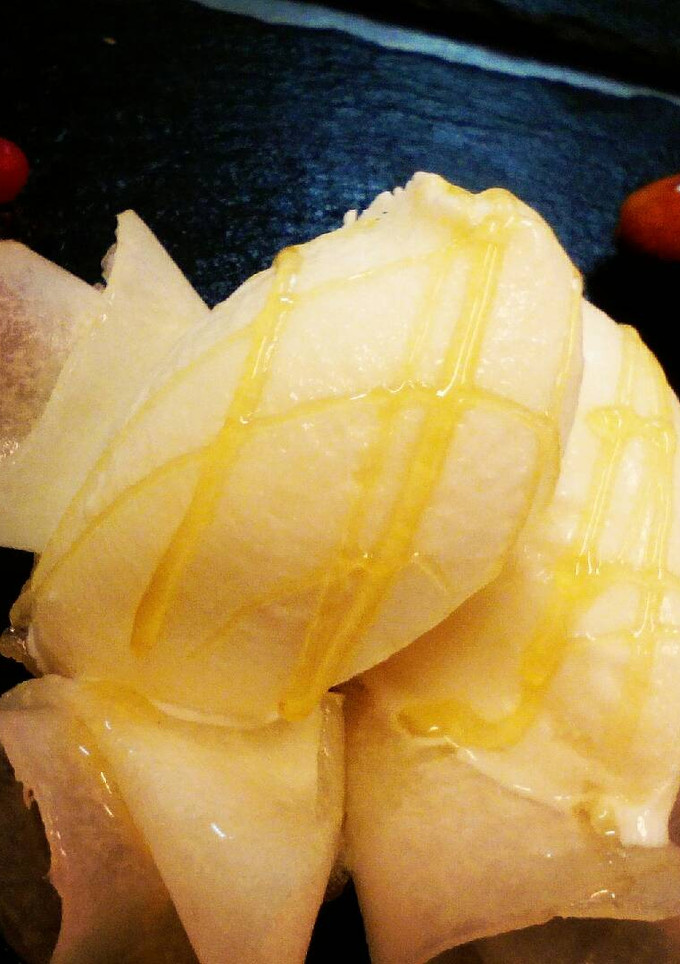 Una foto de Helado de queso con melón