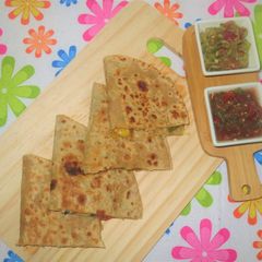 A picture of Sweet Corn and Paneer Quesadillas with Salsa and Guacamole.