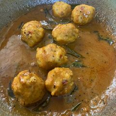 A picture of Tamarind side dish parupu urandai puli kozumbu.