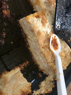 Una foto de Budín de pan y coco