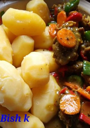 A picture of Boiled irish potatoes with minced meat sauce.