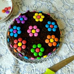 A picture of Eggless Gems Chocolate Cake.