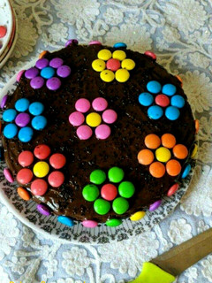 A picture of Eggless Gems Chocolate Cake.