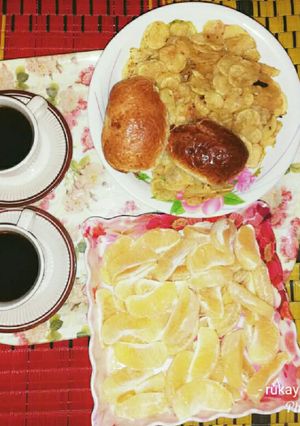 A picture of Fried potato with black tea.