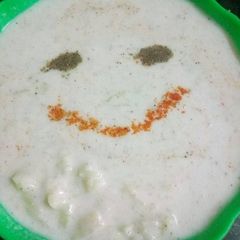 A picture of Ghia and potato raita.