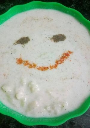 A picture of Ghia and potato raita.