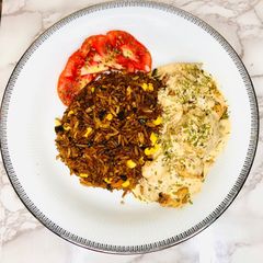 Vegetable fried rice with Fish fillet in cream sauce A picture of Vegetable fried rice with Fish fillet in cream sauce.