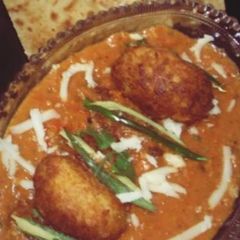 A picture of Malai Kofta in Orange Gravy.