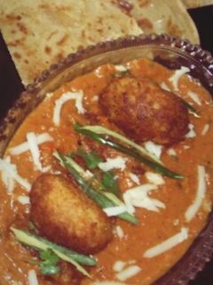 A picture of Malai Kofta in Orange Gravy.