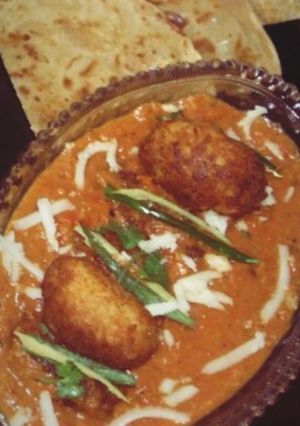 A picture of Malai Kofta in Orange Gravy.