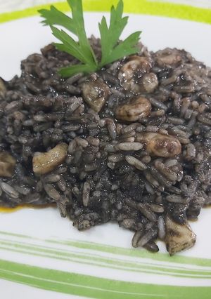 A picture of Black Rice with Squid and Shrimp.