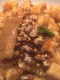 Gnocchi di zucca con porcini e noci tostate al peperoncino