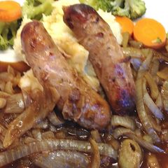 A picture of Sausage & Mash with Rich Onion Gravy.