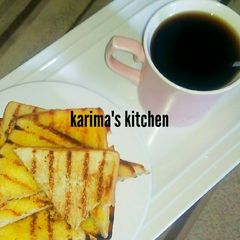 A picture of Butter toast/mint leaves tea.