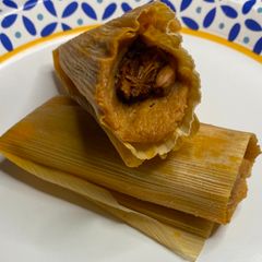 A picture of Vegan Chile Colorado Jackfruit Tamales.